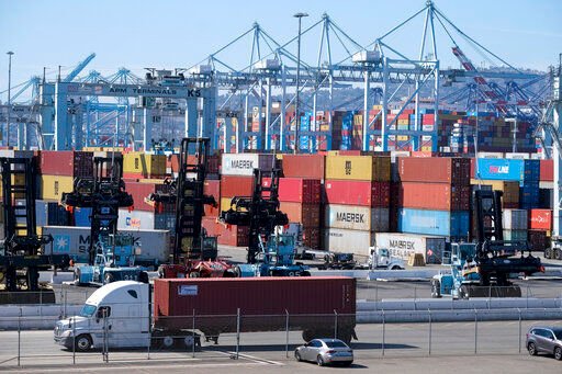 Cargo containers sit stacked at the Port of Los Angeles last month in San Pedro, Calif.