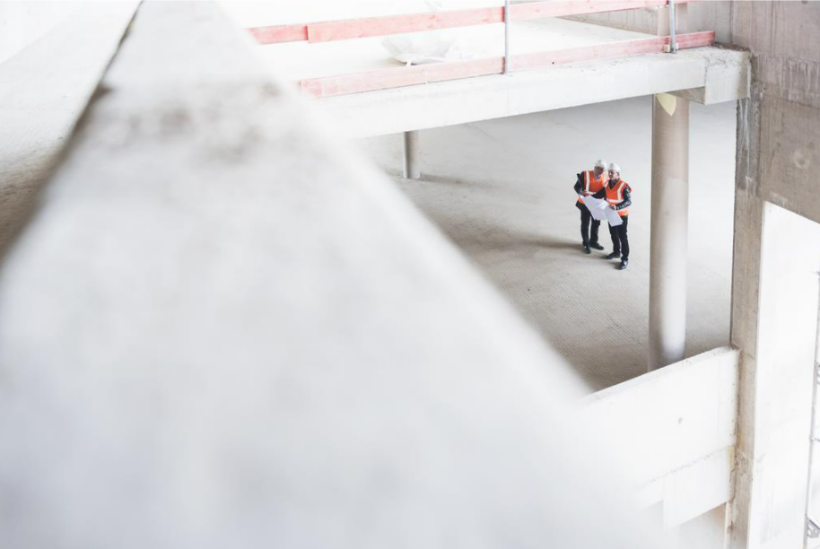 Stock photo of an industrial space with two workers.