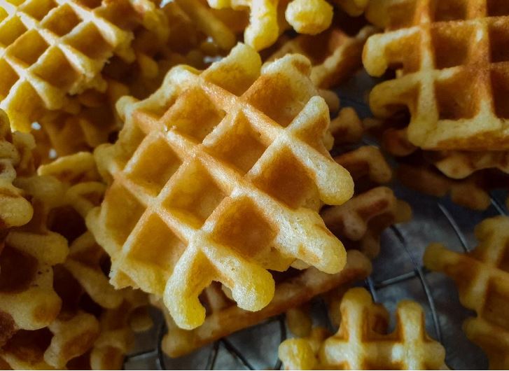 A pile of golden waffles.