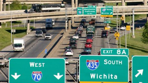 photo of I-70 with cars on the interstate and interstate signs visible