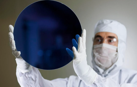 scientist holding up chip