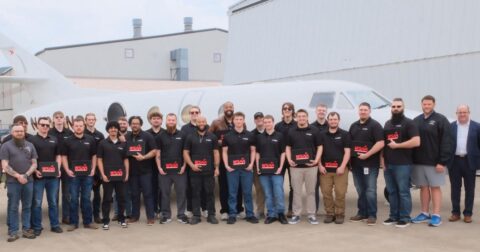Group shot of graduating class of 22 maintenance apprentices of West Star Aviation Academy