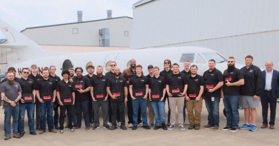 Group shot of graduating class of 22 maintenance apprentices of West Star Aviation Academy