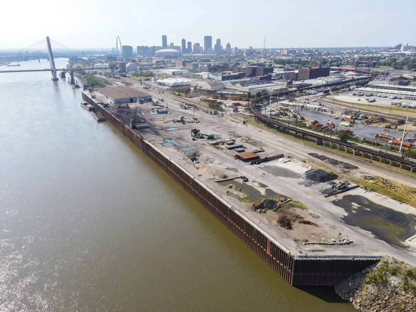 Aerial view of dock along Municipal River Terminal (MRT), with Gateway Arch and St. Louis skyline in the distance