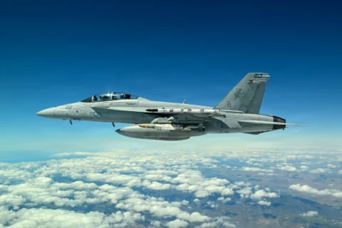 A Navy F/A-18 carries the new Joint Direct Attack Munition (JDAM) Long Range (LR) variant during a test event in early April off the coast of California (U.S. Navy photo/released)